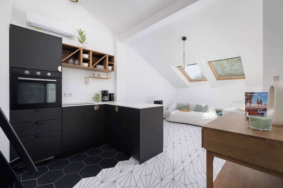 A straight-on view of the kitchen area, showing all appliances and workspace.