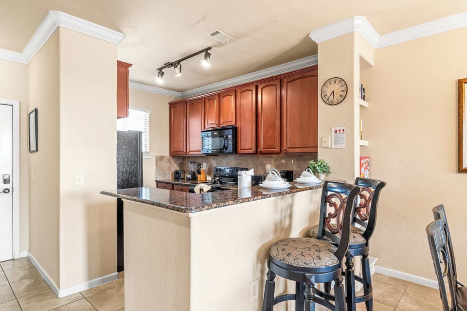 Sip morning coffee or grab a bite at the kitchen counter, with space for 2​