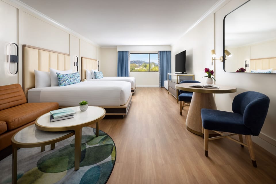 Settle into a spacious studio with lounge, desk, and view.