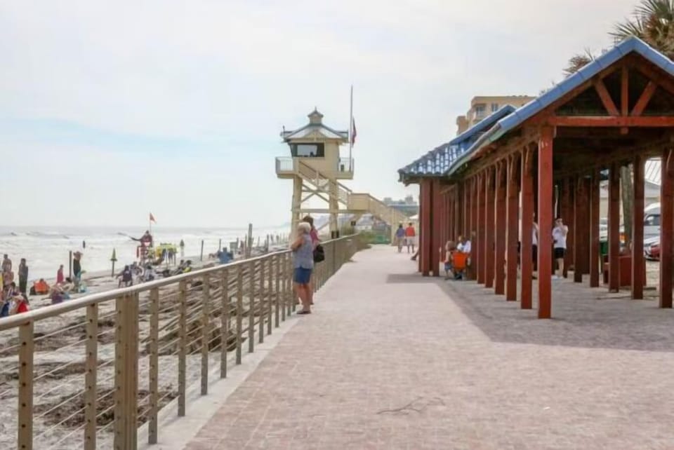 Stroll along the vibrant beachfront boardwalk just steps from your beach stay. Enjoy ocean views, lifeguard stations, and easy access to the sand, surf, and local attractions.