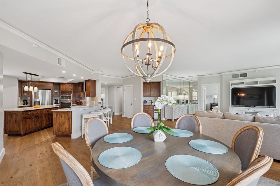 The layout flows easily into the dining area, creating an inviting setting for relaxing, gathering, and enjoying the natural surroundings.