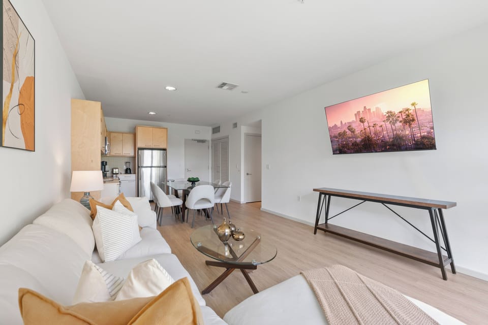 Light wood-tone flooring extends throughout the space