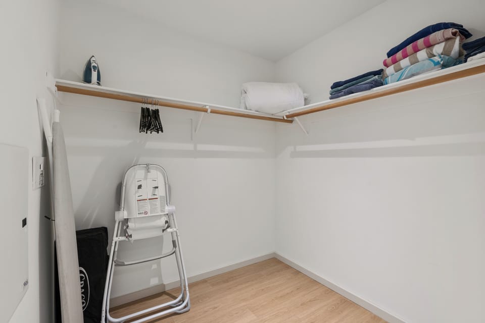 A spacious walk-in closet offers ample storage and organizational potential