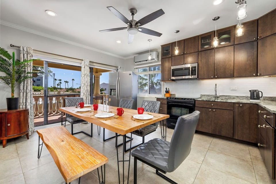 Gather around the modern dining table for memorable meals, cozy conversations, or a perfect workspace—where style meets function in the heart of your stay.
