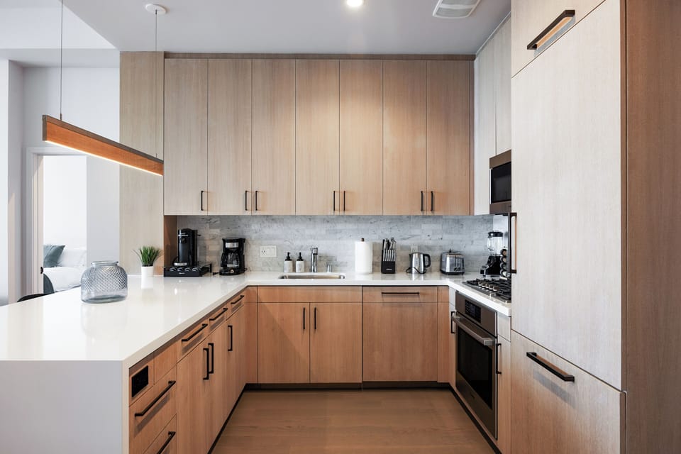Prepare meals on the expansive quartz island, perfect for gathering and dining