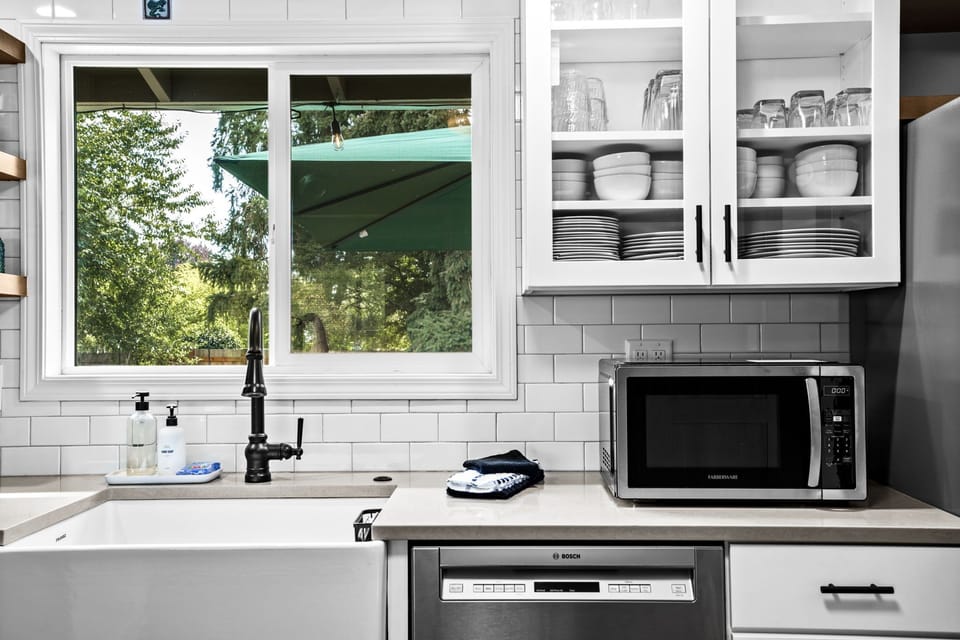 Fully stocked kitchen with coffee station.