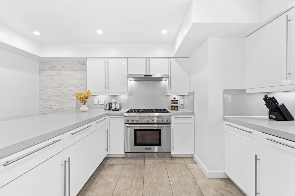 High-end stainless steel appliances make cooking a joy.