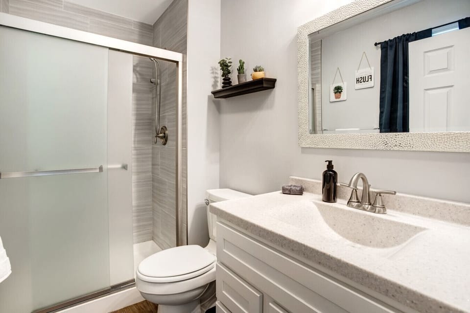 Updated bathroom with walk-in shower and clean, modern finishes