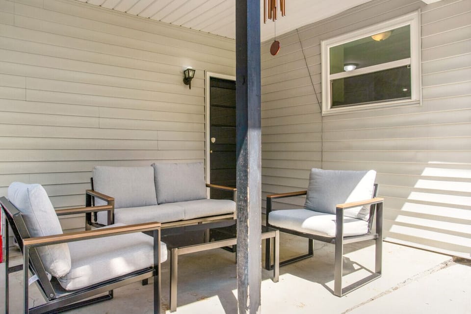 Relax outdoors on the private patio with cozy seating and a hammock—perfect for unwinding after a long day.