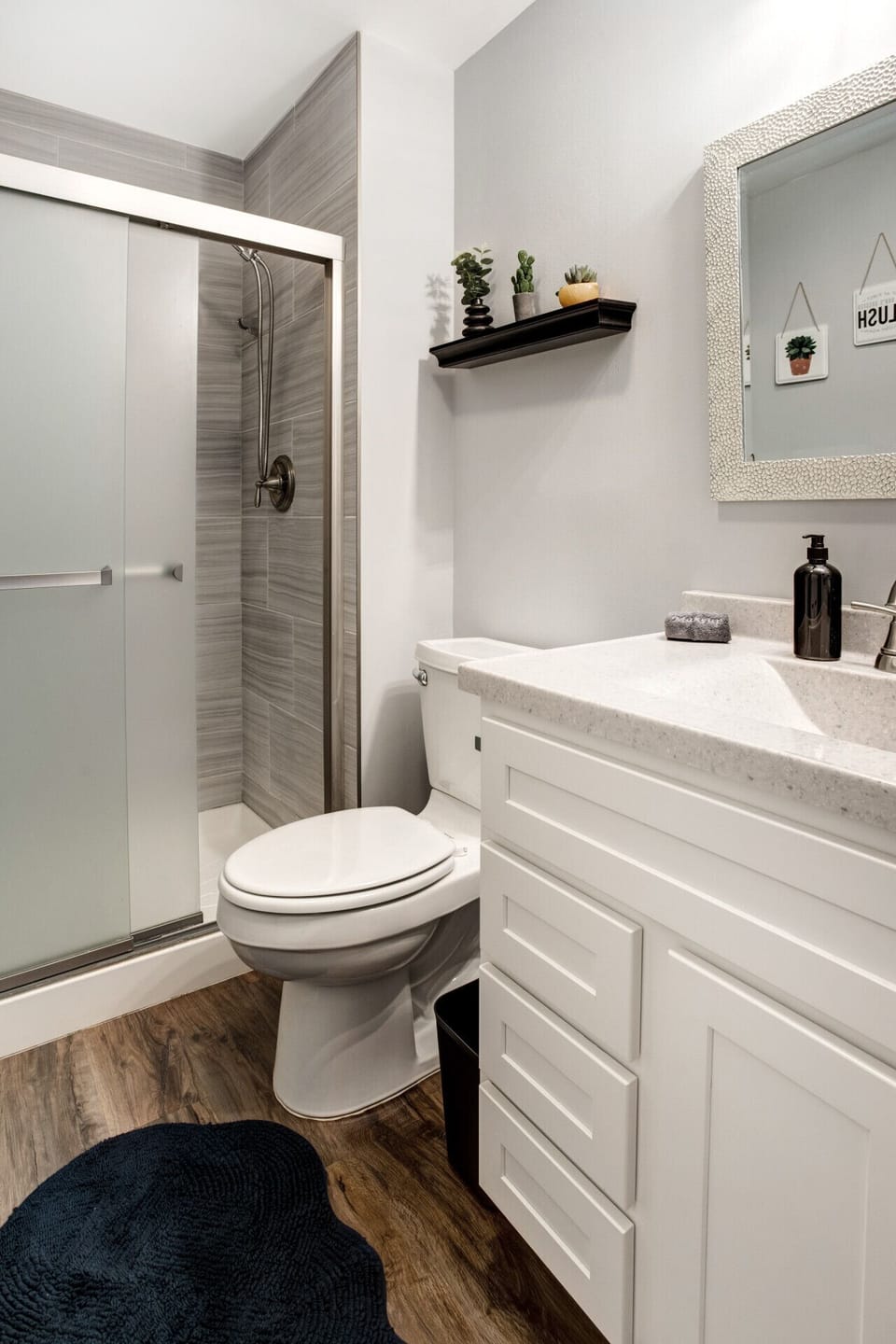 Updated bathroom with walk-in shower and clean, modern finishes