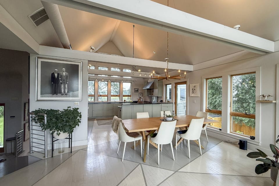 Wall-to-wall windows + vibrant design = the ultimate modern coastal retreat.