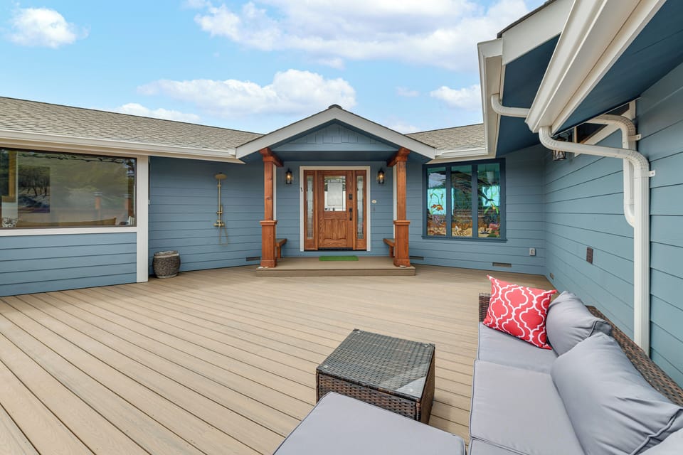 Property Exterior | Single-Story Home | Outdoor Shower | Porch w/ Seating