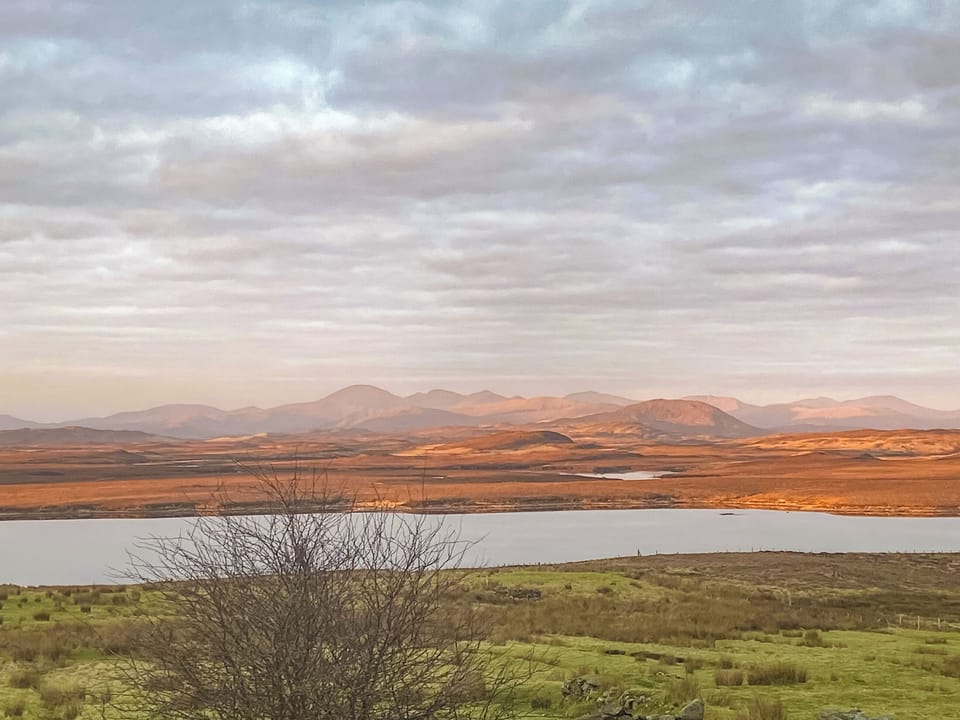 Watch as the sun paints the mountains with colours every morning! | Go Ye Cottage, Achmore