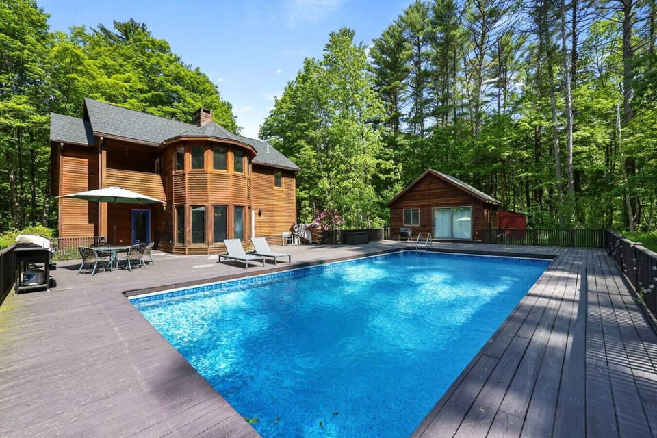 Expansive pool deck with plenty of space for lounging, grilling, and soaking up the sun.