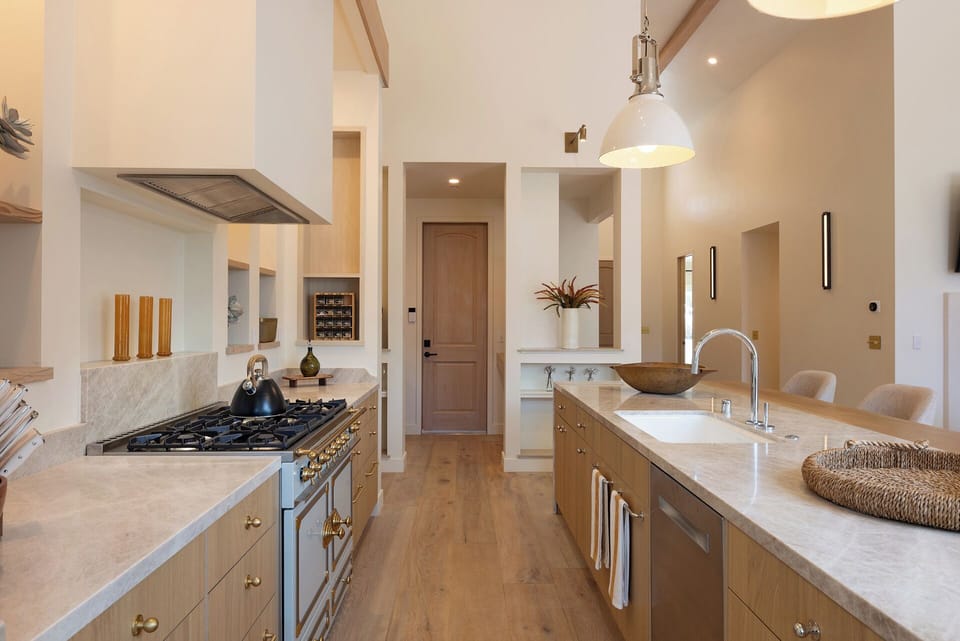 Kitchen leading pantry and garage