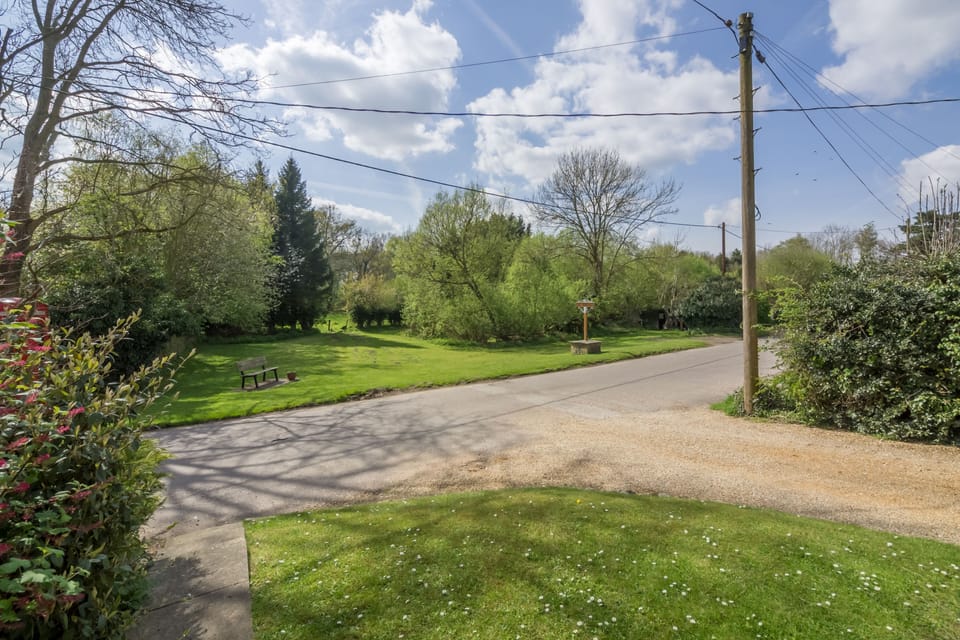 The entrance driveway leading to the parking area at the back of the cottage