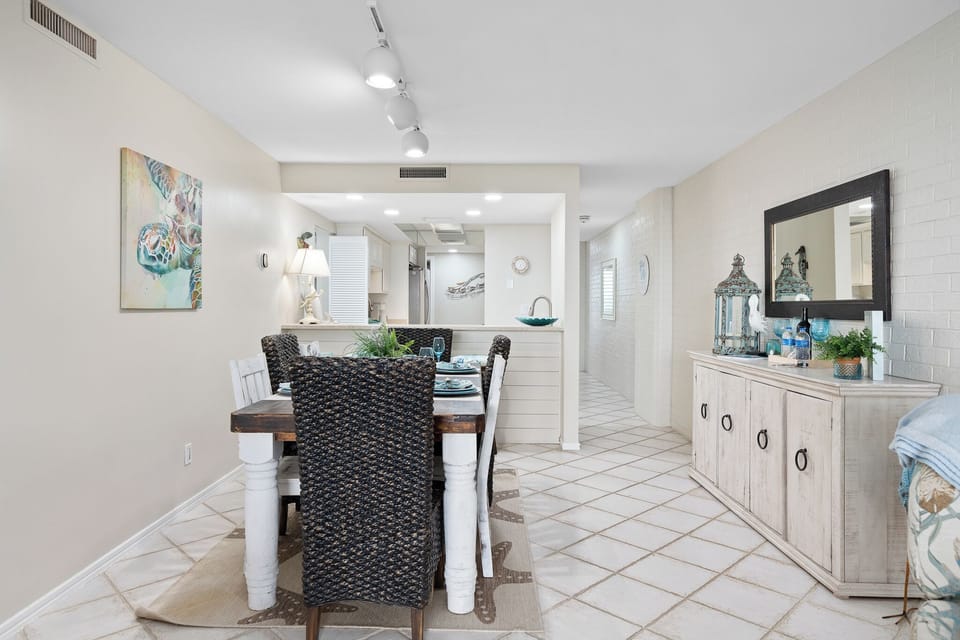 Dining space flows seamlessly into the kitchen with stylish accents.