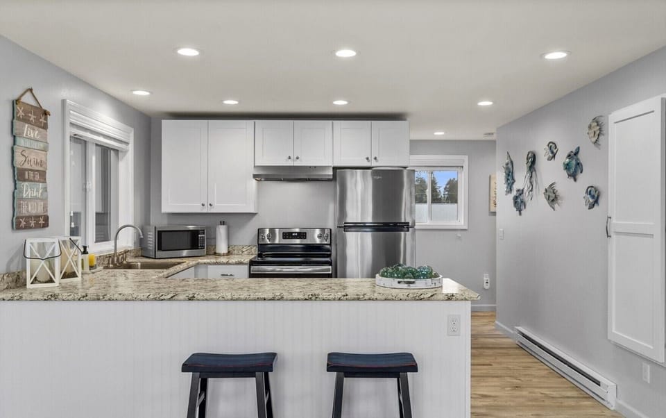 Bright open kitchen with stainless steel appliances
