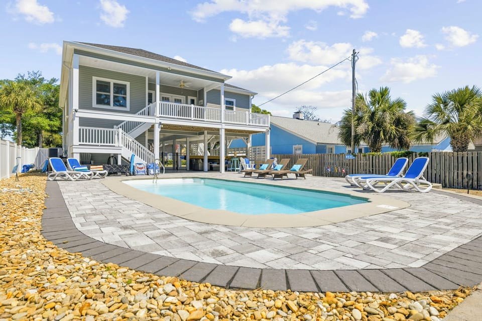 Private pool, sunny patio, and spacious deck for the perfect beach getaway,