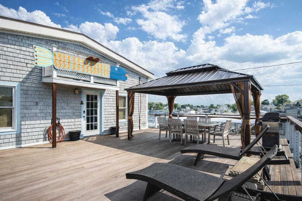 Expansive deck with pergola and water views