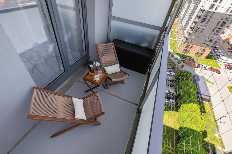 Balcony with garden furniture.