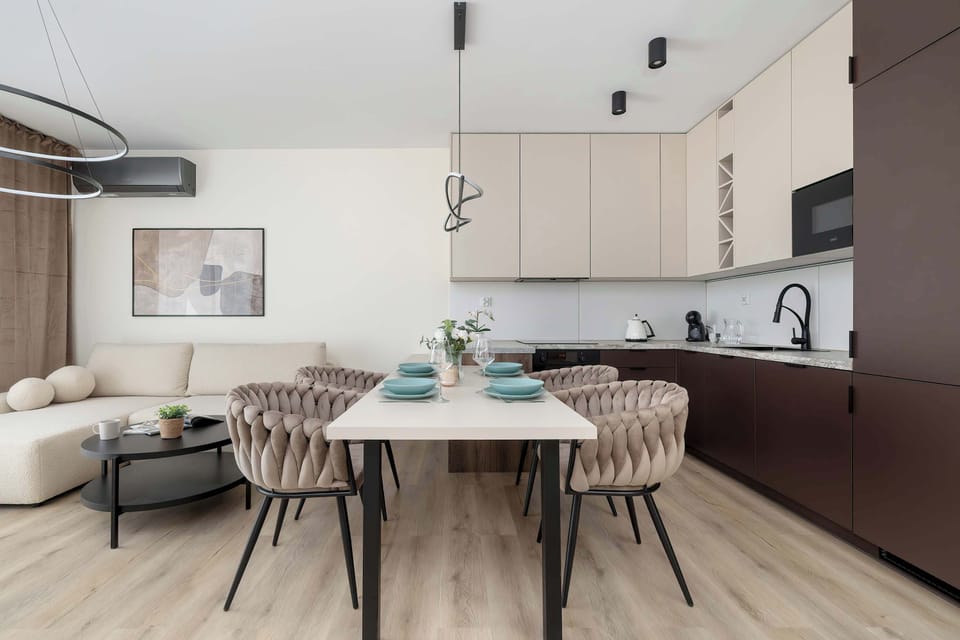 The living room's sleek design is both functional and aesthetically pleasing.