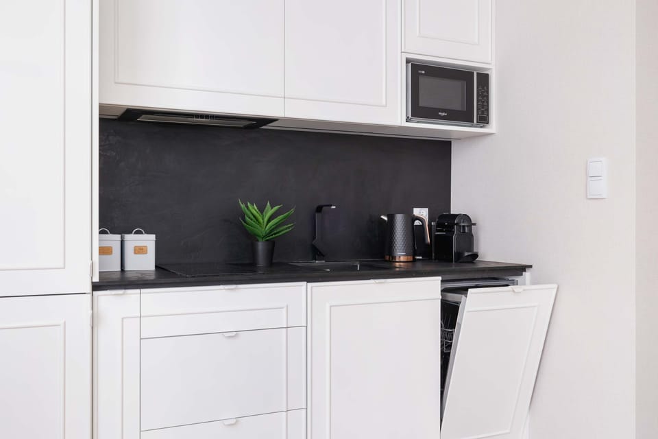 The kitchen is equipped with high-quality appliances that allow you to prepare home-cooked meals.
