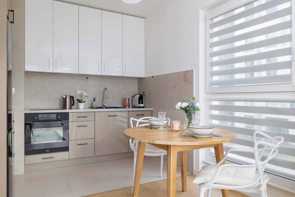 Kitchenette with oven and refrigerator. 