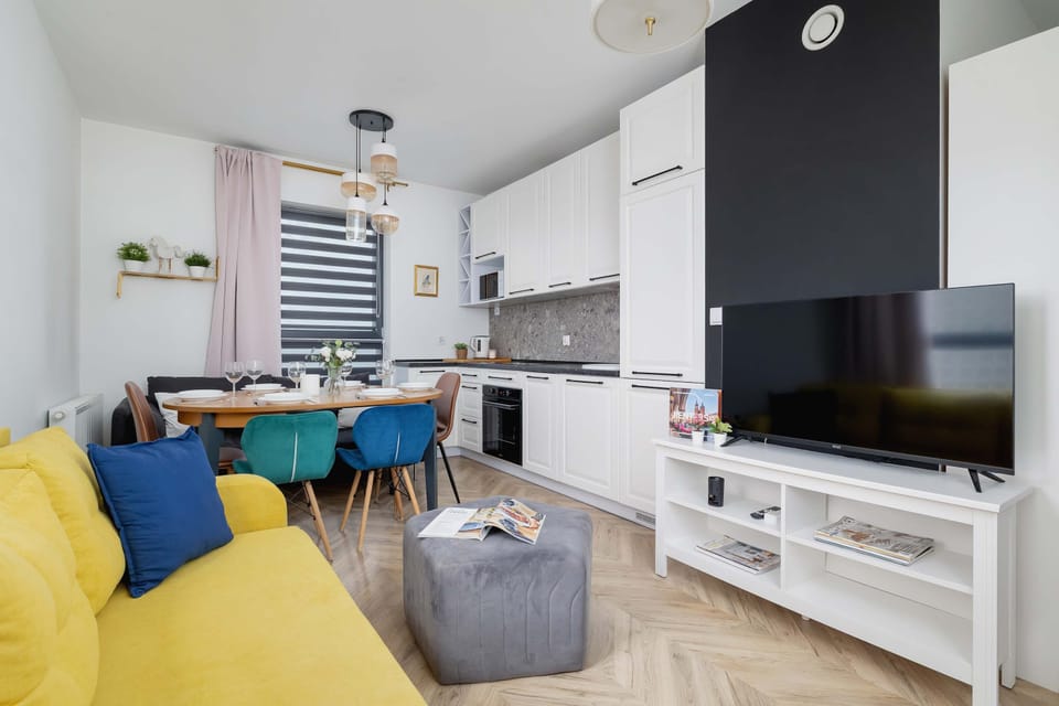 Harmonious combination of living area and kitchenette.