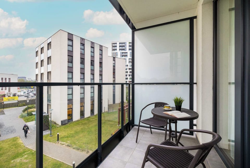 The balcony creates an ideal space for relaxing outdoors and also sharing a meal or morning coffee.