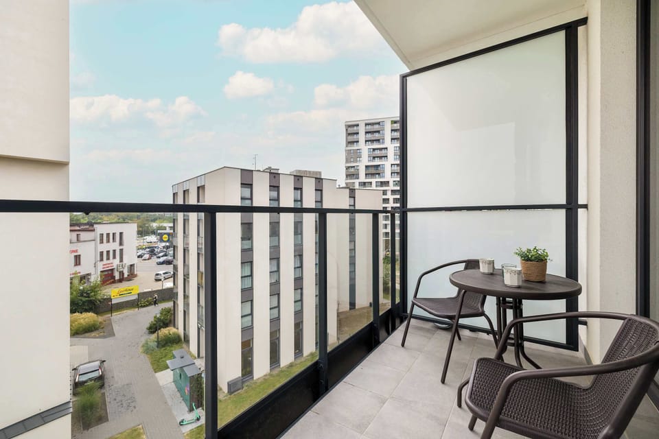 The balcony creates an ideal space for relaxing outdoors and also sharing a meal or morning coffee.