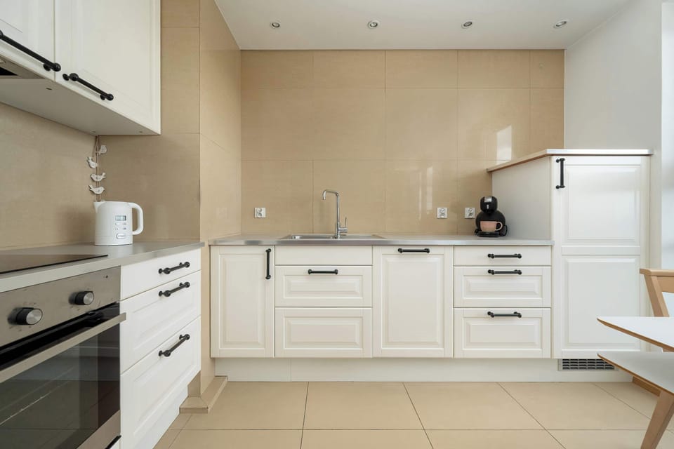 A bright, well-lit kitchen combines convenience with style, creating the perfect space for cooking together.