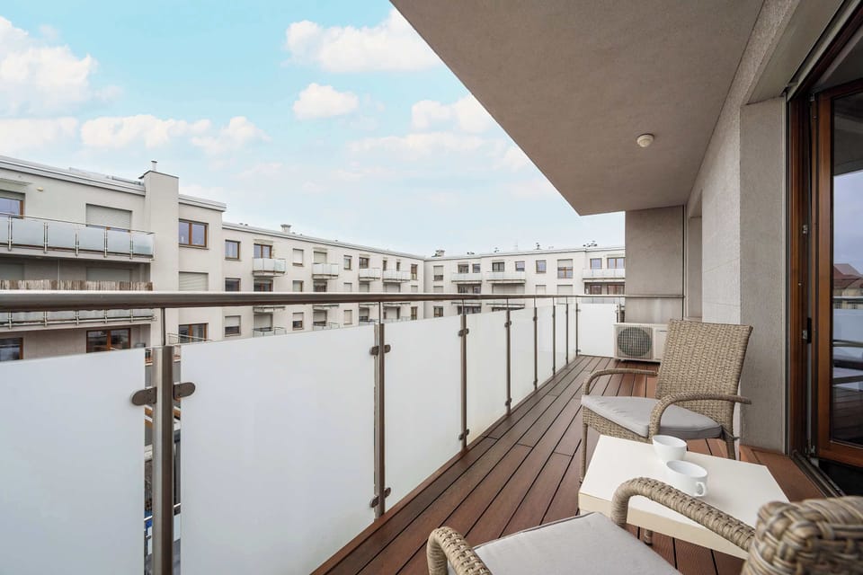 The balcony provides a tranquil spot for enjoying a book.