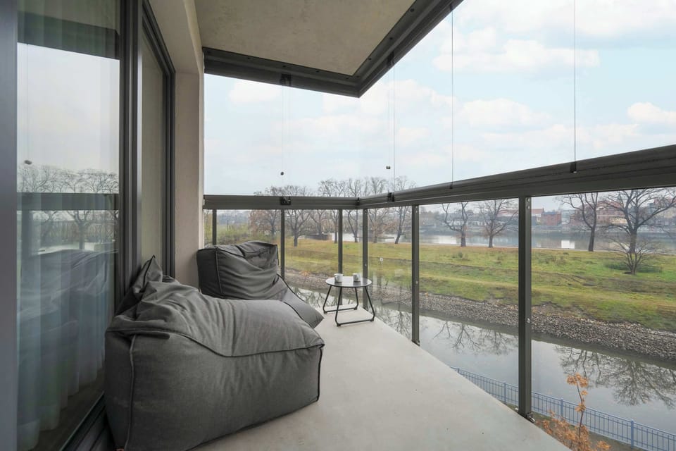 The balcony's stylish design complements the apartment's decor.