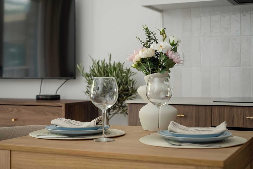 Close-up of a table setting with decorative flowers and dishes.