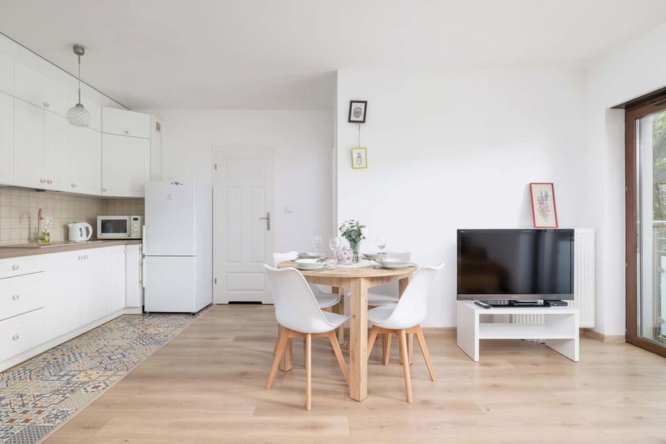 Kitchenette with dining area and TV in the living room.