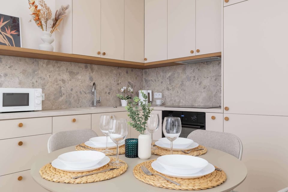 A lovely round table will be the perfect place to eat meals prepared together in the kitchenette.