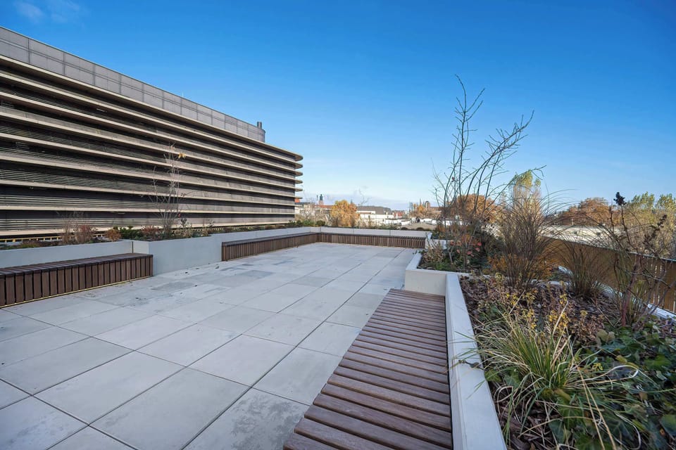 Enjoy the view from the inviting and modern terrace in the common area.