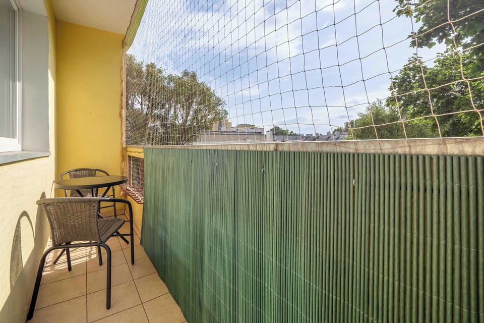The balcony provides a perfect spot for enjoying the fresh air. 