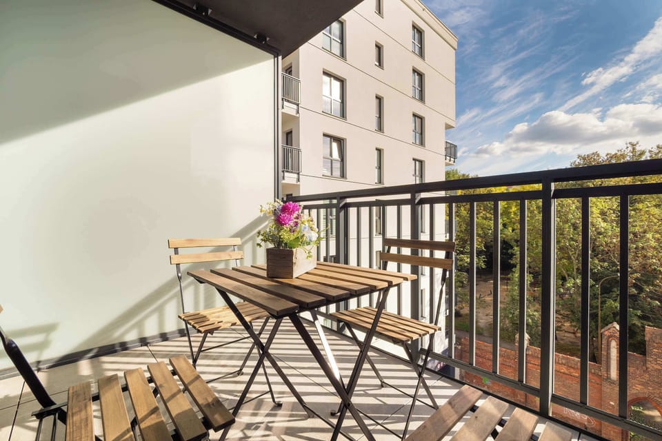 The balcony is the perfect place to take a relaxing sip of coffee or unwind after a busy day.