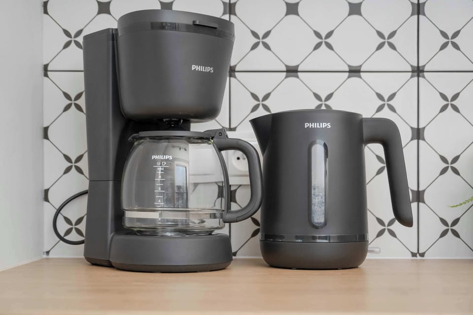 A close-up of the coffee making facilities - a coffee machine and electric kettle.