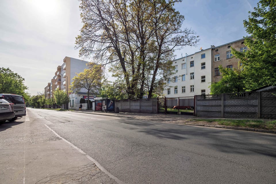 The street in front of the building offers easy access to public transport and daily amenities.

