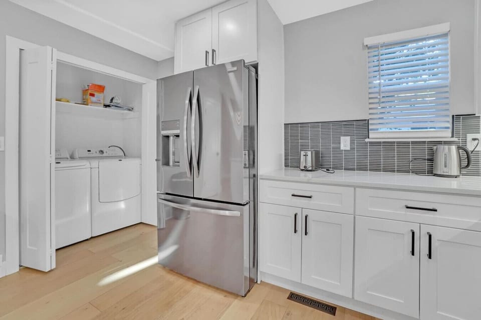 Beautifully updated and fully stocked kitchen with bar seating