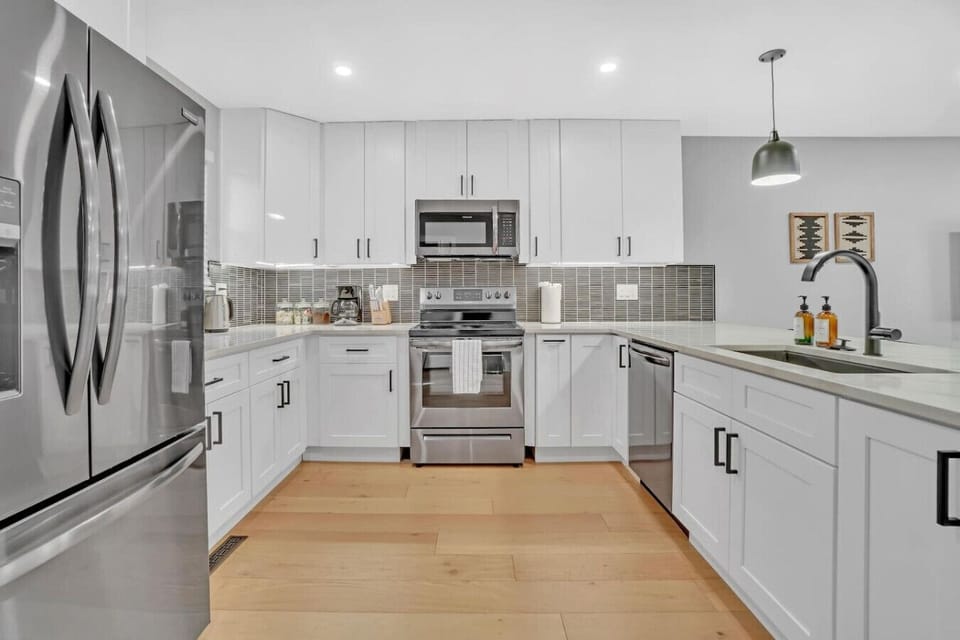 Beautifully updated and fully stocked kitchen with bar seating