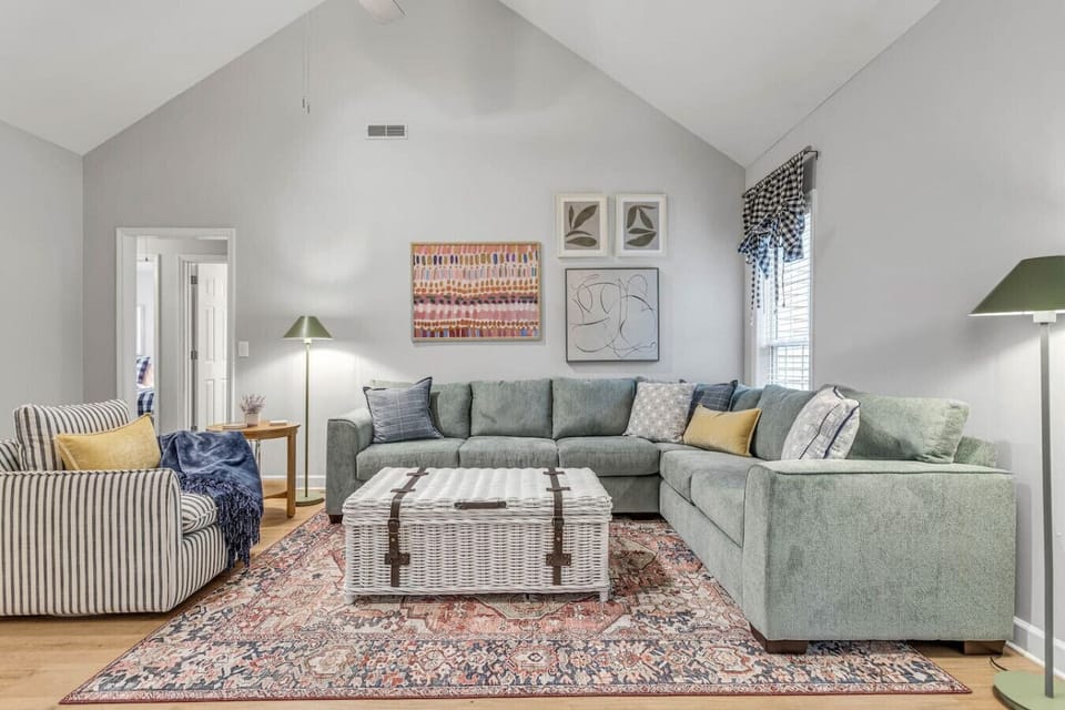Living room with high vaulted ceilings.