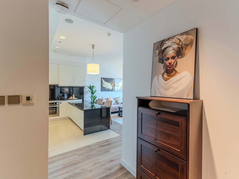 Modern Kitchen & Living Space. Experience sleek designs and vibrant art in this inviting retreat!