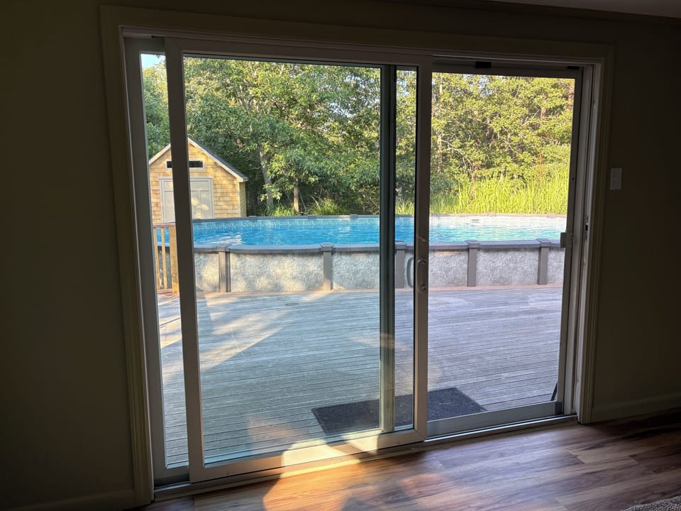 Oversized sliders that walk out to deck and above ground saltwater pool