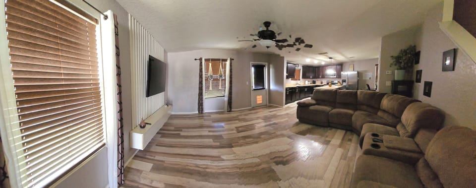 The living room comfortably seats up to 7 guests, offering a cozy space to relax