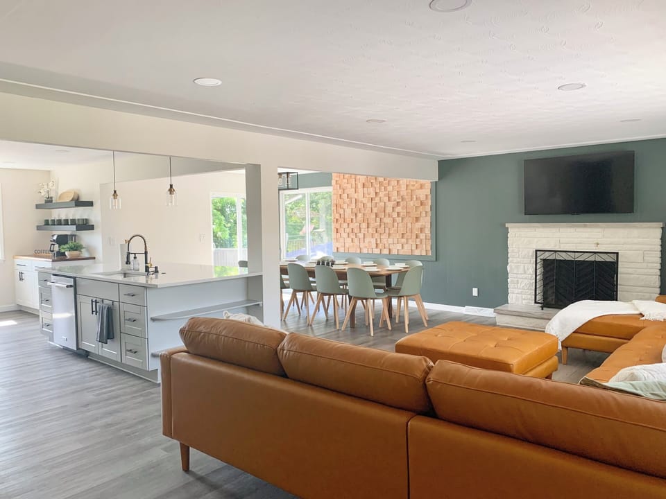 Open concept Living Room, Dining Room & Kitchen w/ slider to upper deck.