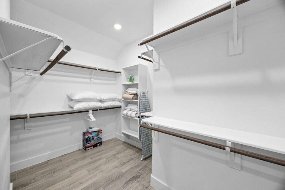 Spacious walk-in closet with ample storage—perfect for longer stays or unpacking comfortably
